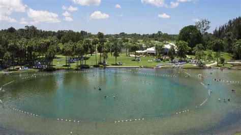 Warm mineral springs park - Warm Mineral Springs Park is actually a sinkhole some 230 feet deep, shaped like an hourglass. A few yards below the water's surface, the space narrows to 157 feet.